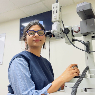 Kiran sitting at optometry laser