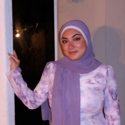 Lama wearing floral outfit