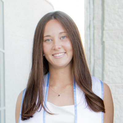Lilly wearing a white dress