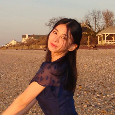 Naomi posing on the beach