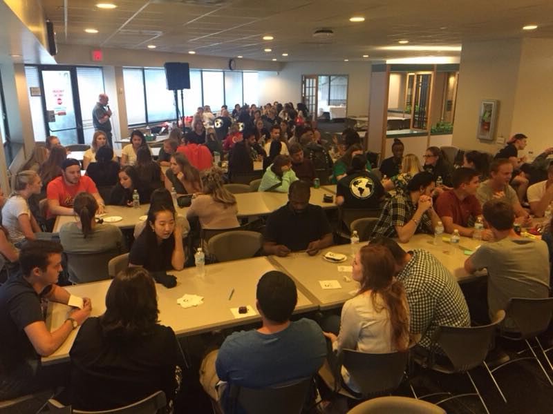 students sitting in the cafeteria at orientation