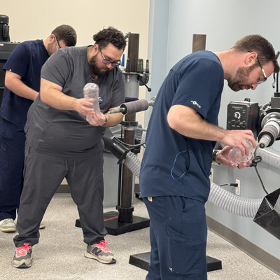 Eduardo and O&P students in lab