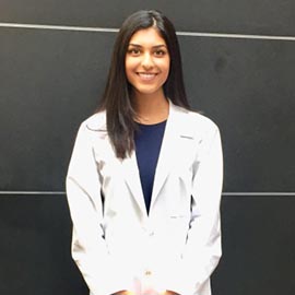 Sonia headshot in her white coat