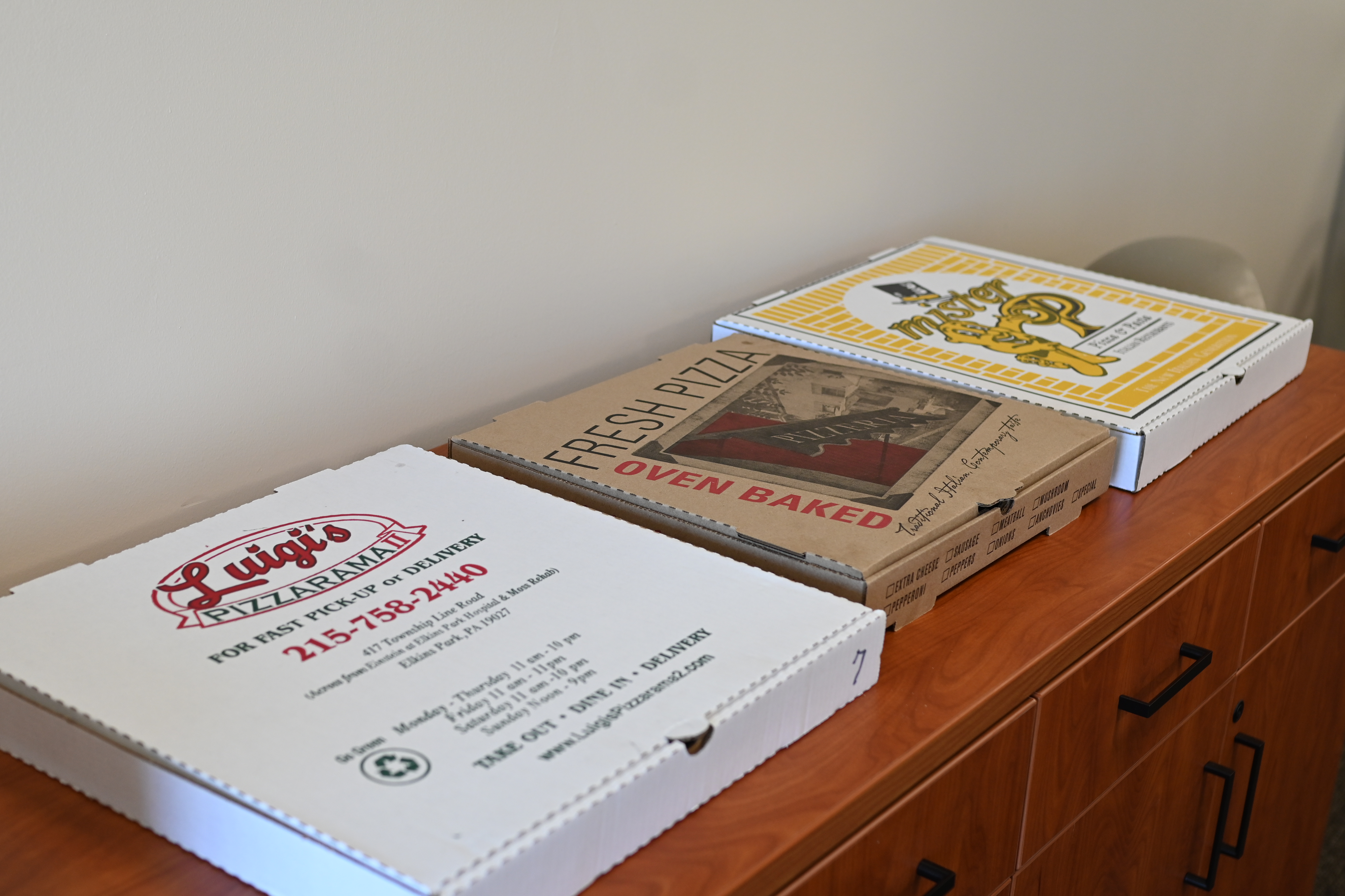 three pizza boxes