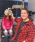 Chad Killen giving an eye exam