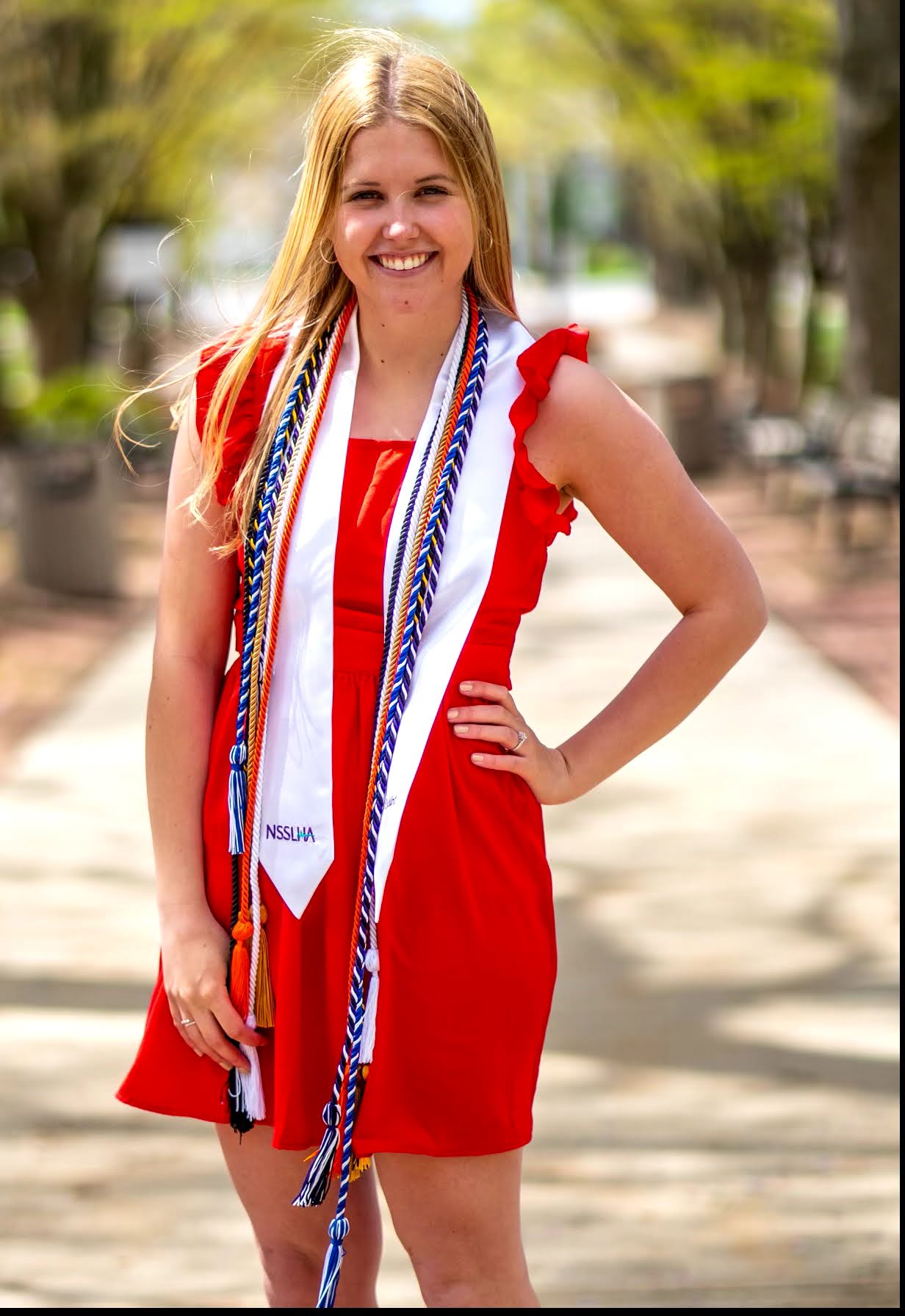 Rachel in her graduation stoll and cords