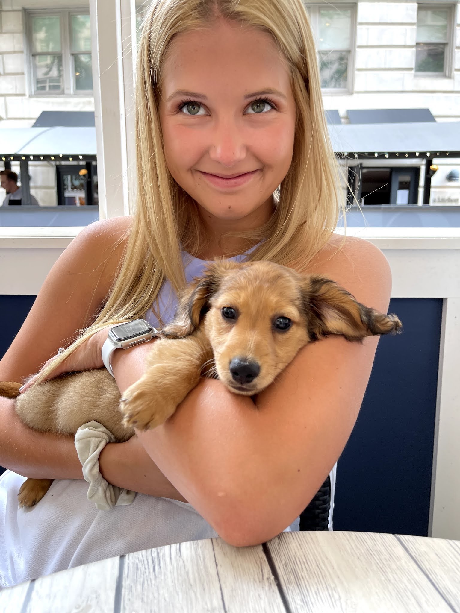 Rachel holding her dog