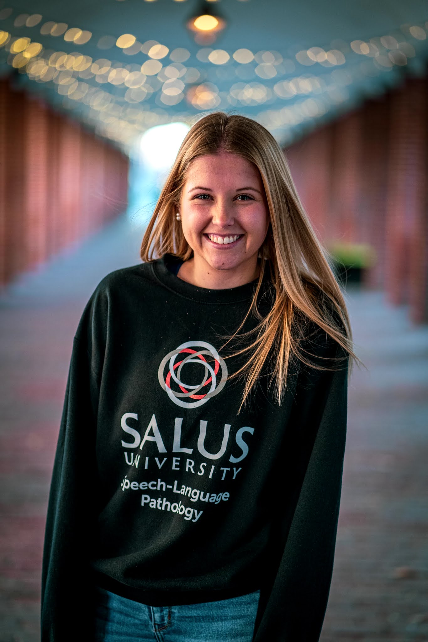 Rachel headshot in a Salus SLP sweatshirt