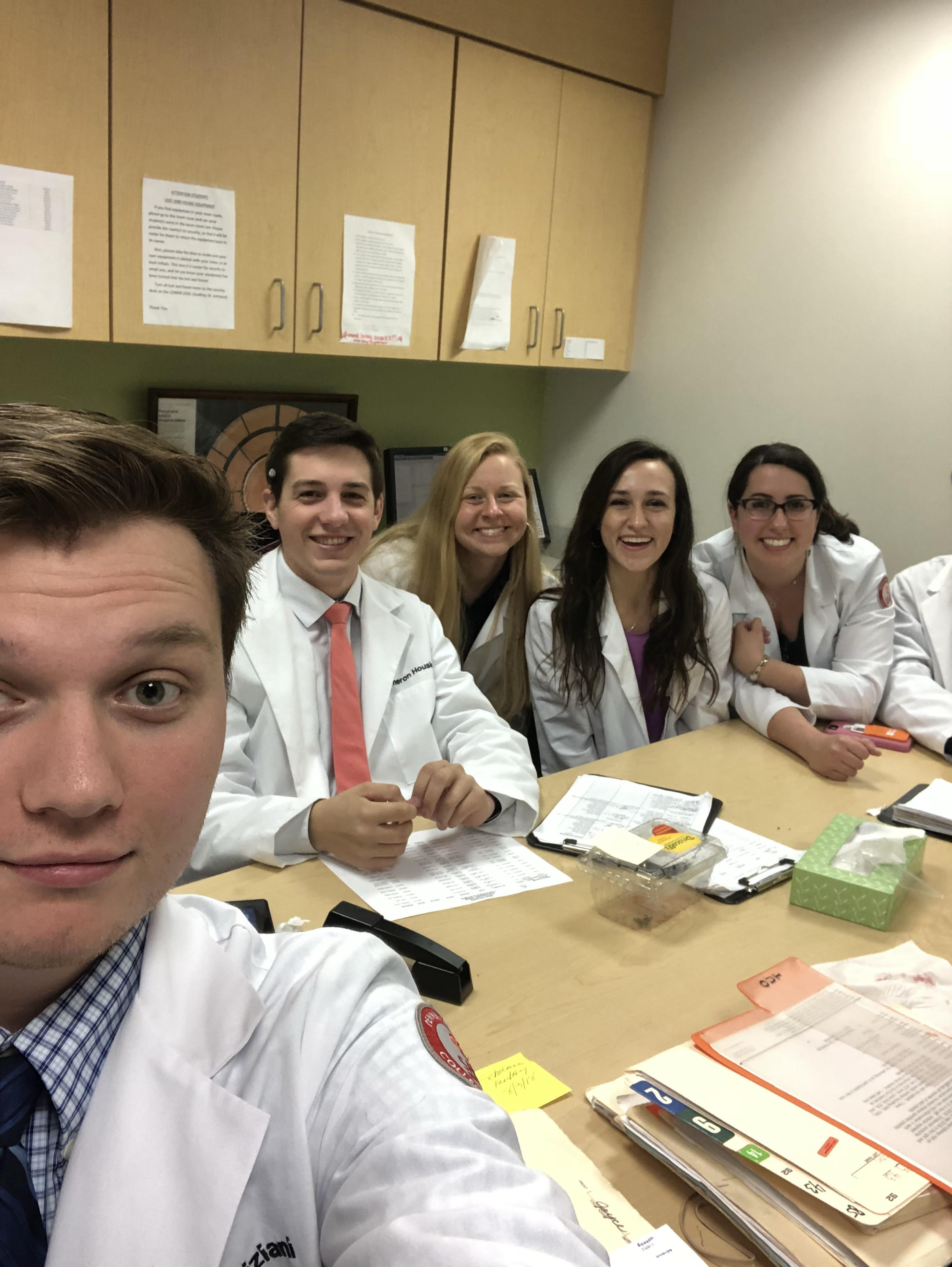 John taking a selfie with his classmates