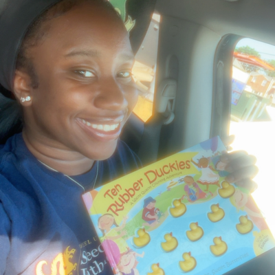 Sierra holding a children's book