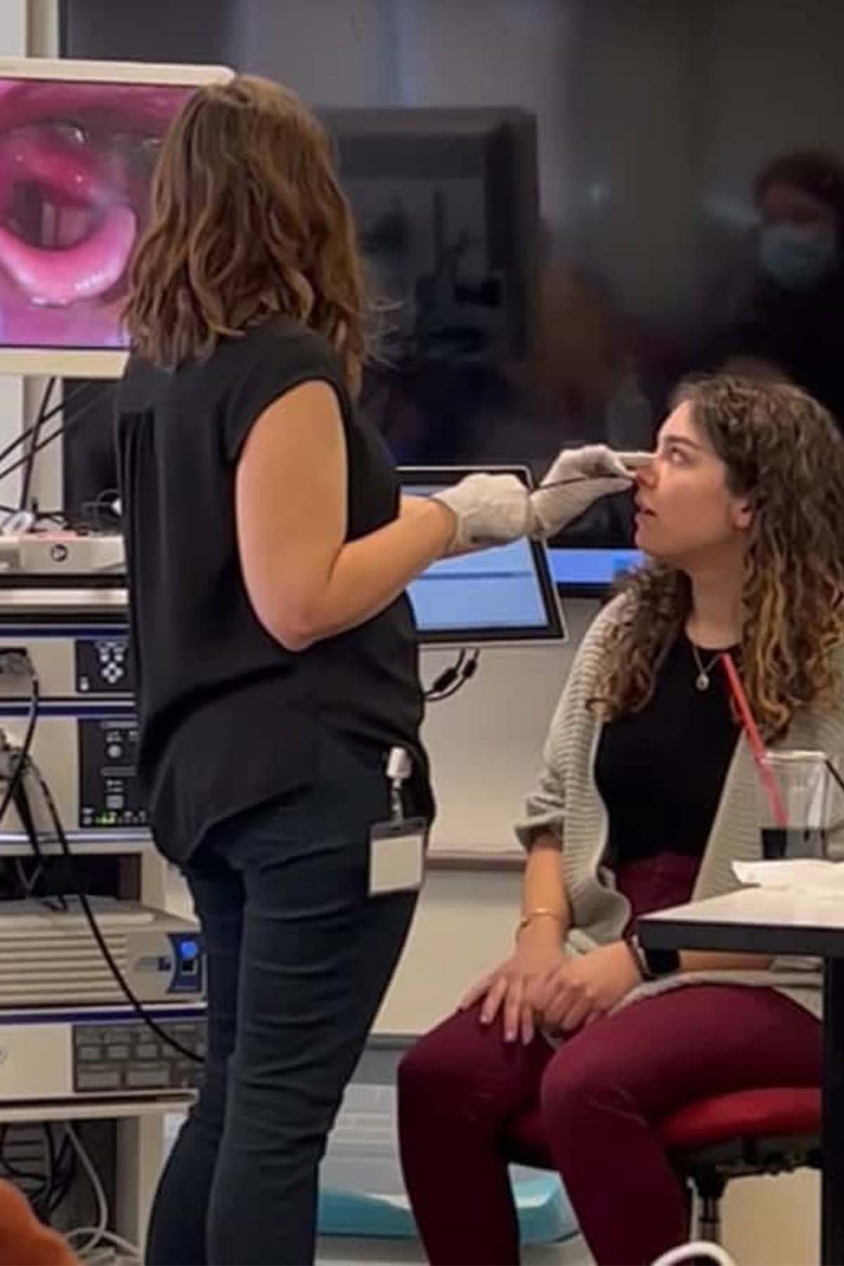 Sophie Wollman and fellow student clinician gaining hands-on clinical experience