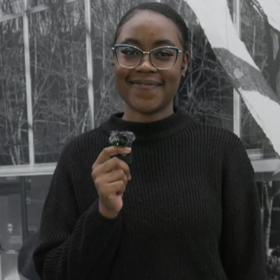 Stacey holding a microphone