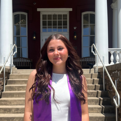 Sydney wearing a purple sash