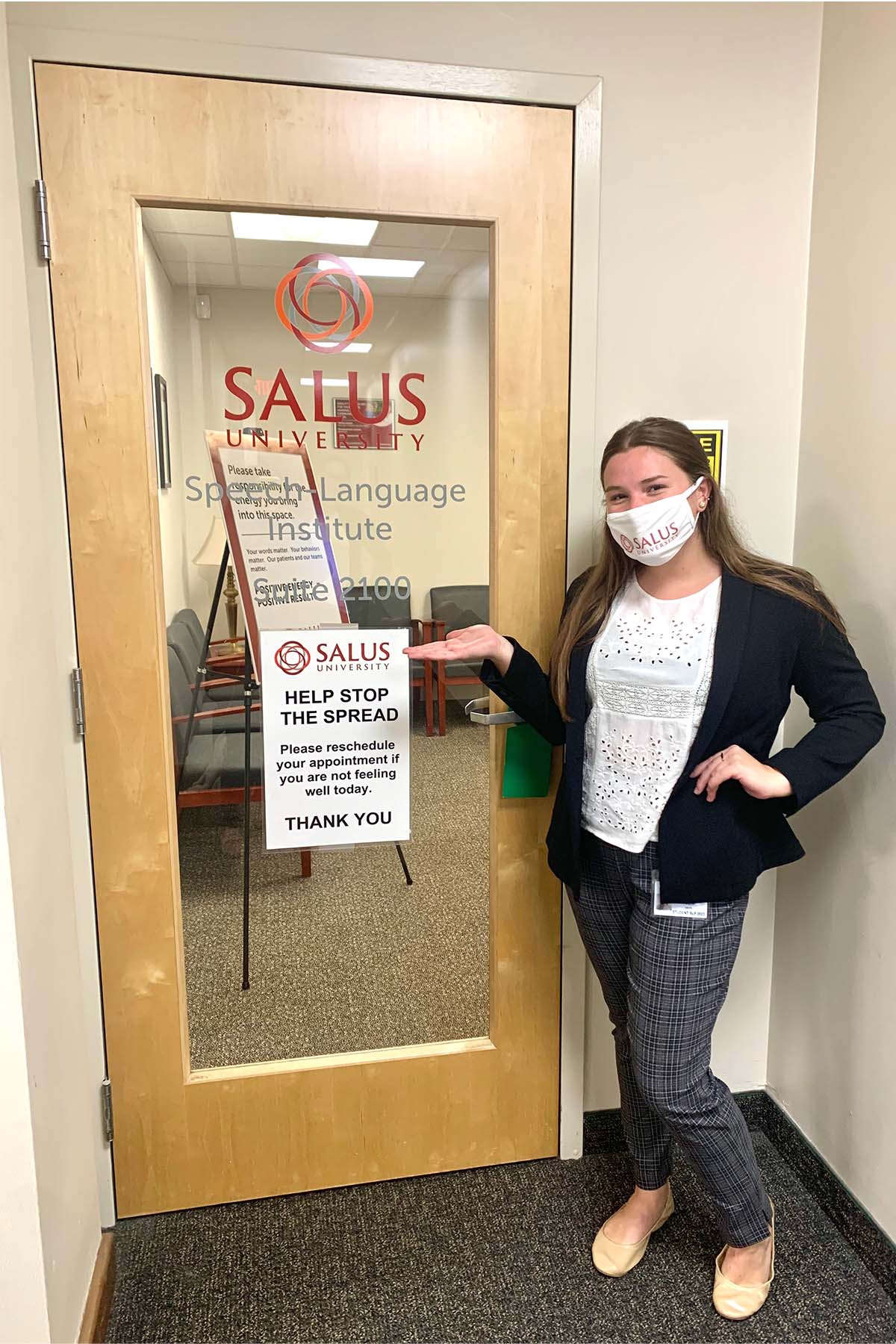 Tobin standing in front of the Speech-Language Institute
