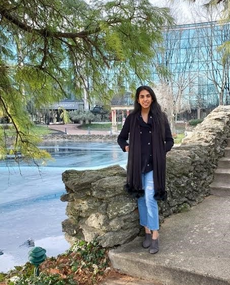 Sonali standing in front of the Salus pond