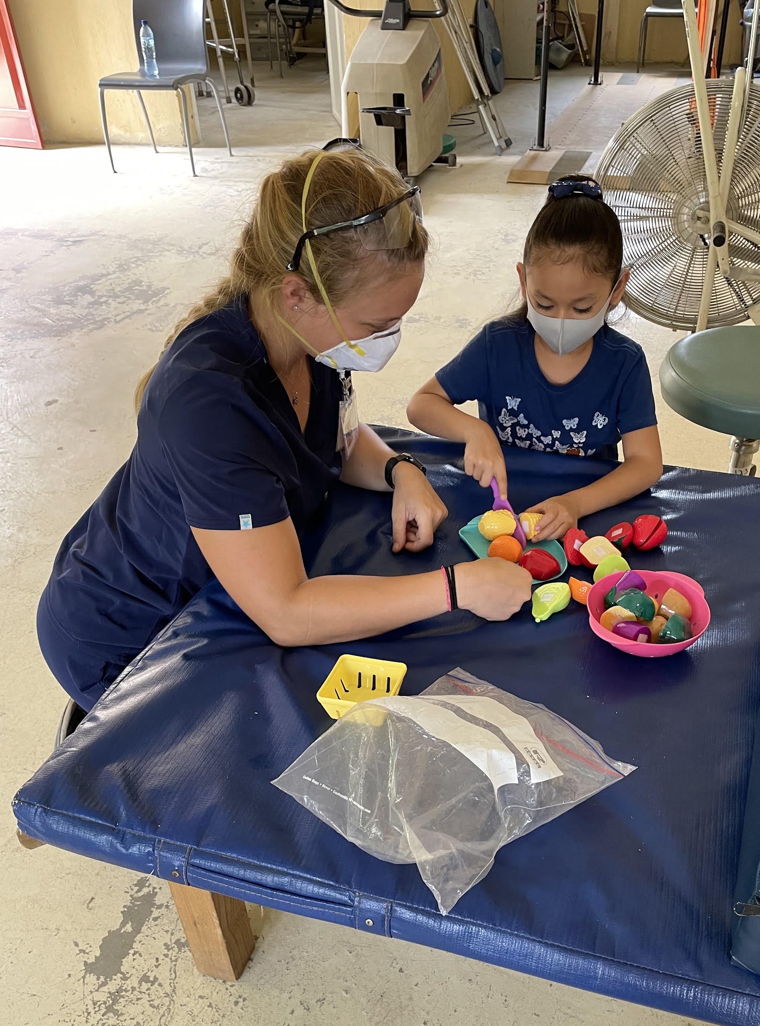 Robin working as an OT with a child patient