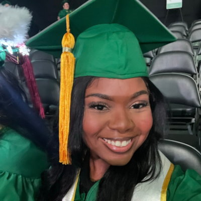 Yosefa wearing grad cap